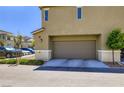Attached garage offering convenient parking and storage, complemented by low-maintenance landscaping at 12282 Azure Gate Rd # 4, Las Vegas, NV 89183
