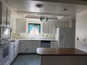 Bright kitchen equipped with ample cabinetry and modern appliances at 1590 Raindance Way, Las Vegas, NV 89169