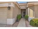 View of the front entrance of the home with a well maintained walkway at 1816 Eagle Mesa Ave, Henderson, NV 89012
