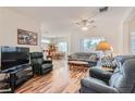 Open-concept living room with hardwood floors and plenty of natural light at 1816 Eagle Mesa Ave, Henderson, NV 89012