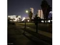 Street view of city buildings and palm trees, showcasing the vibrant neighborhood surroundings at 2217 Santa Ynez Dr, Las Vegas, NV 89104