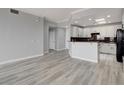 Open concept kitchen with white cabinets and modern appliances at 27 E Agate Ave # 505, Las Vegas, NV 89123