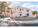 Corner lot home featuring a balcony, two car garage, xeriscaped front yard, and a red tile roof at 2789 Trotwood Ln, Las Vegas, NV 89108