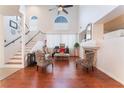 Bright and airy living room boasts vaulted ceilings, a fireplace, and stylish decor at 2789 Trotwood Ln, Las Vegas, NV 89108
