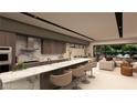 Modern kitchen featuring a long island with barstool seating, an open floorplan, and sleek, minimalist design at 3961 Heron Fairway Dr, Las Vegas, NV 89141
