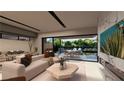 Bright, modern living room with a large sliding glass door to the patio, a marble fireplace and a plush couch at 3961 Heron Fairway Dr, Las Vegas, NV 89141