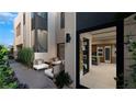 Inviting outdoor courtyard with comfortable seating adjacent to the kitchen at 4086 Heron Fairway, Las Vegas, NV 89141