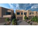 Contemporary homes featuring private driveways and modern architectural design at 4086 Heron Fairway, Las Vegas, NV 89141