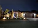 Beautiful single-story home illuminated at night, featuring desert landscaping at 444 Viewmont Dr, Henderson, NV 89015