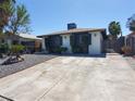 Well-maintained exterior with a spacious concrete driveway and simple landscaping features at 4509 Bingham Ave, Las Vegas, NV 89110
