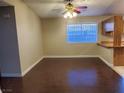 Inviting space with wood-look floors, ceiling fan, and view of the kitchen area at 4509 Bingham Ave, Las Vegas, NV 89110
