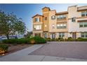 Inviting townhome exterior showcasing desert landscaping, sidewalk, and convenient parking, enhancing curb appeal at 51 Morning Mimosa Ct, Henderson, NV 89012