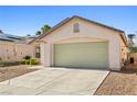 Charming single-story home featuring a two-car garage, low maintenance desert landscaping and neutral color palette at 5112 Foggia Ave, Las Vegas, NV 89130
