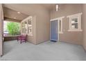Inviting covered front porch with a charming bench, providing a welcoming entrance to the home at 5542 Oak Bend Dr, Las Vegas, NV 89135