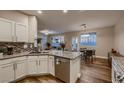 Bright kitchen with granite countertops, stainless steel appliances, and a breakfast bar at 672 Solitude Point Ave, Henderson, NV 89012