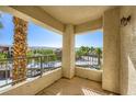 Relaxing covered balcony offering city views, perfect for outdoor seating and enjoying the scenery at 7127 S Durango Dr # 310, Las Vegas, NV 89113