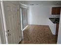 Inviting open space with neutral tile flooring and abundant natural light at 8865 Knickknack Ct, Las Vegas, NV 89149