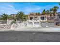 Mediterranean-style home featuring a three-car garage, balcony, and well-maintained landscaping at 953 Pyrite Ave, Henderson, NV 89011