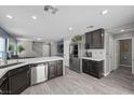 Open kitchen with stainless steel appliances, ample cabinet space, and a breakfast bar at 106 Basketflower Ct, Las Vegas, NV 89183