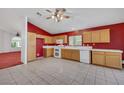Bright kitchen featuring light wood cabinets and tiled floor at 1230 Pagentry Dr, North Las Vegas, NV 89031