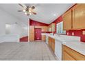 Bright kitchen featuring light wood cabinets and tiled floor at 1230 Pagentry Dr, North Las Vegas, NV 89031