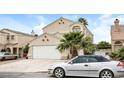 Charming two-story home with a well-manicured lawn, a two-car garage and a driveway at 1345 Stokes St, Las Vegas, NV 89110