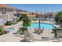 Gorgeous pool and spa with desert landscaping and comfortable seating perfect for entertaining at 144 Desert Valley Dr, Boulder City, NV 89005