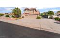 Charming two-story home with well-maintained desert landscaping and an attached two-car garage at 1587 Bermuda Dunes Dr, Boulder City, NV 89005