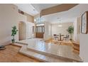 Bright foyer connecting living spaces, featuring tile flooring and decorative front door with high ceilings at 175 Palta Ct, Henderson, NV 89074