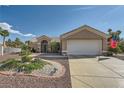 Well-maintained one-story home with desert landscaping and a two-car garage at 2401 Ocean Edge Ct, Las Vegas, NV 89134