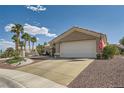 Charming home featuring a desert landscaped yard, tiled roof, and two-car garage at 2401 Ocean Edge Ct, Las Vegas, NV 89134