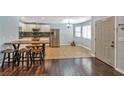 Open dining area with tile flooring, wood table and seating at 2708 Beaver Creek Ct # 202, Las Vegas, NV 89117