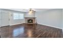 Spacious living room with hardwood floors and a stone fireplace at 2708 Beaver Creek Ct # 202, Las Vegas, NV 89117