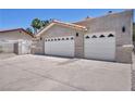 Two car garage with decorative accents, ample parking space and secure entry for peace of mind at 3421 Rochelle Ct, Las Vegas, NV 89121
