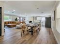 Spacious living room boasting an open layout, modern fireplace, and stylish wood flooring at 4072 E Harmon Ave, Las Vegas, NV 89121
