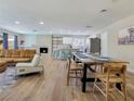 Bright living room with sleek wooden floors, comfortable seating, and easy access to the modern kitchen at 4072 E Harmon Ave, Las Vegas, NV 89121
