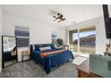 Cozy main bedroom with a large bed, sliding glass doors, and plenty of natural light at 41 Strada Moscato, Henderson, NV 89011