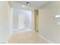 Bright entryway featuring tiled flooring, fresh paint, and modern fixtures at 453 Winter Dove Ave, Henderson, NV 89011
