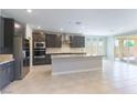Open kitchen with granite countertops, stainless steel appliances, and modern cabinetry at 453 Winter Dove Ave, Henderson, NV 89011