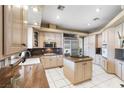 Spacious kitchen with island, granite countertops, and stainless steel refrigerator at 4545 W Agate Ave, Las Vegas, NV 89139