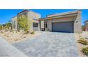 Beautiful exterior with a three-car garage and desert-friendly landscaping at 4750 Outlook Peak St, Las Vegas, NV 89135