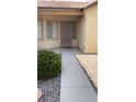 Inviting front porch with security door and walkway at 5004 Wayfaring Tree Ave, Las Vegas, NV 89131