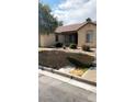 Charming exterior with a well-manicured front yard at 5004 Wayfaring Tree Ave, Las Vegas, NV 89131