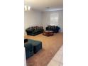 Comfortable living room featuring plush sofas and natural light at 5004 Wayfaring Tree Ave, Las Vegas, NV 89131