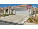 Charming single-story home with a two-car garage, desert landscaping, and tiled roof at 5489 Royal Vista Ln, Las Vegas, NV 89149