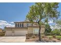 Two-story home with a three car garage and well maintained landscape at 6103 Sundown Crest St, Las Vegas, NV 89113