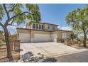 Spacious two-story home with a three-car garage and concrete driveway at 6103 Sundown Crest St, Las Vegas, NV 89113