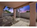 Outdoor living space with a cozy patio area perfect for relaxation and enjoying the backyard at 615 Cervantes Dr, Henderson, NV 89014
