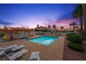 Enjoy the community pool and patio with lounge chairs at this well maintained residential property at 615 Cervantes Dr, Henderson, NV 89014