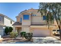 Inviting two-story home featuring a two-car garage and well-maintained landscaping at 6241 Overhang Ave, Henderson, NV 89011